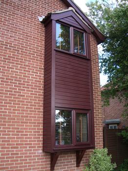 Rosewood windows with rosewood Toungy & Groove Cladding