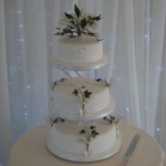 Logo - Lily of the Valley and Butterflies wedding cake