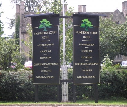 Post and panel signs with lighting