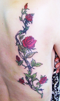 West Coast Tattoos' Colour work by Blan. Roses & barbed wire.