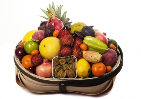 Tropical Trug Gift fruit basket- A selection of the finest exotic fruits available outside the Carribean. This basket can contain funky pink/yellow dragon fruit, sweet sharon fruit, star fruit, sunny papaya, also when available, a super sweet del monte pi