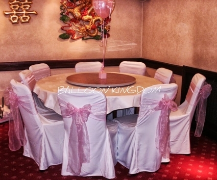 Loose skirt chair covers with pale pink organza sash