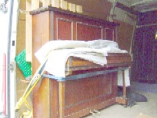 piano strapped in for its journey