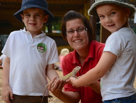 Young visitors meet a Bearded Dragon
