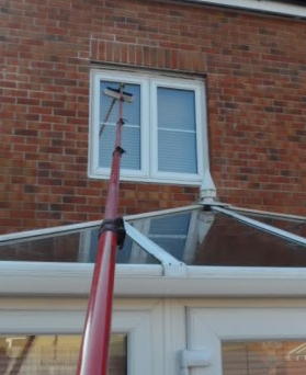Window cleaning above a conservatory